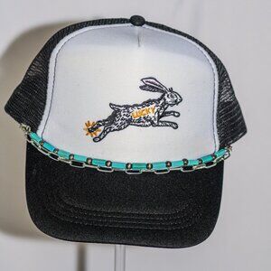 Black and white "Lucky Rabbit" trucker hat with hat jewelry